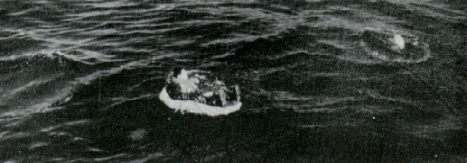 Lou Ives in his life raft before pickup by USS Hailey (DD-556) 2 FEB 1953