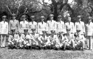 Midshipman 1st class G. C. Canaan, standing second from right, receives his wings of gold, 12 April 1950.U. S. Navy photo.