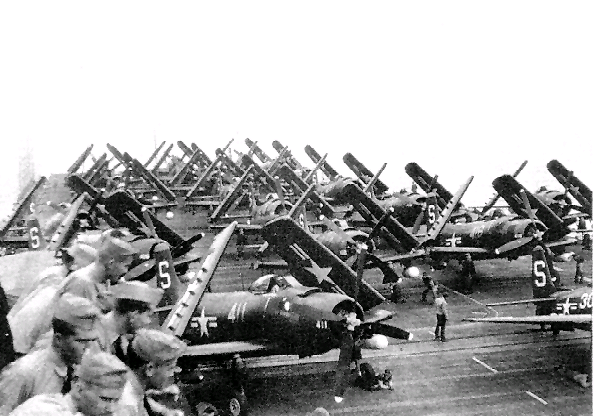 50 miles west of NAS San Diego in the Pacific Ocean, VA-55 and VA-54 AD-2 Skyraiders plus VF-53 F8F-2 Bearcats on the aft end of CV-45 USS Valley Forge