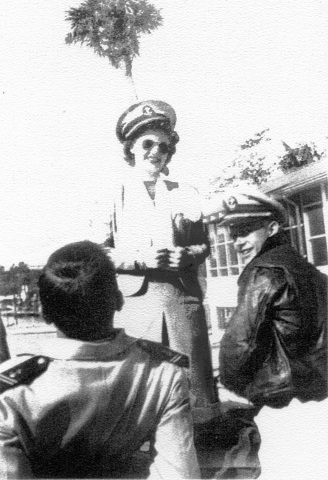 left to right: Aviation Mid’n 2/c "Hal" Marr (back of head), Mildred Ann "Toni" Randall (we were married 8/25/50), Aviation Mid’n 2/c R. T. J. “Woody" Wood    Picture taken at Weekie Wachee Springs, FL.    Christmas 1947