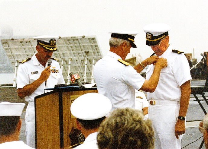 ENS Kenneth A. Schechter being awarded the DFC 40 years late.    Presented by VADM Robert J. Spane    Aboard USS Constellation (CV-64)                  September 1995