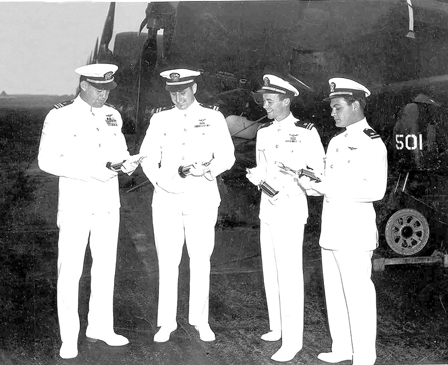 Dive Bombing Champs of the Pacific Fleet          left to right: LCDR William House, LT Gendron, LTjg Miller, and ENS Sizemore    VA-115   AD2 aircraft    North Island    1949