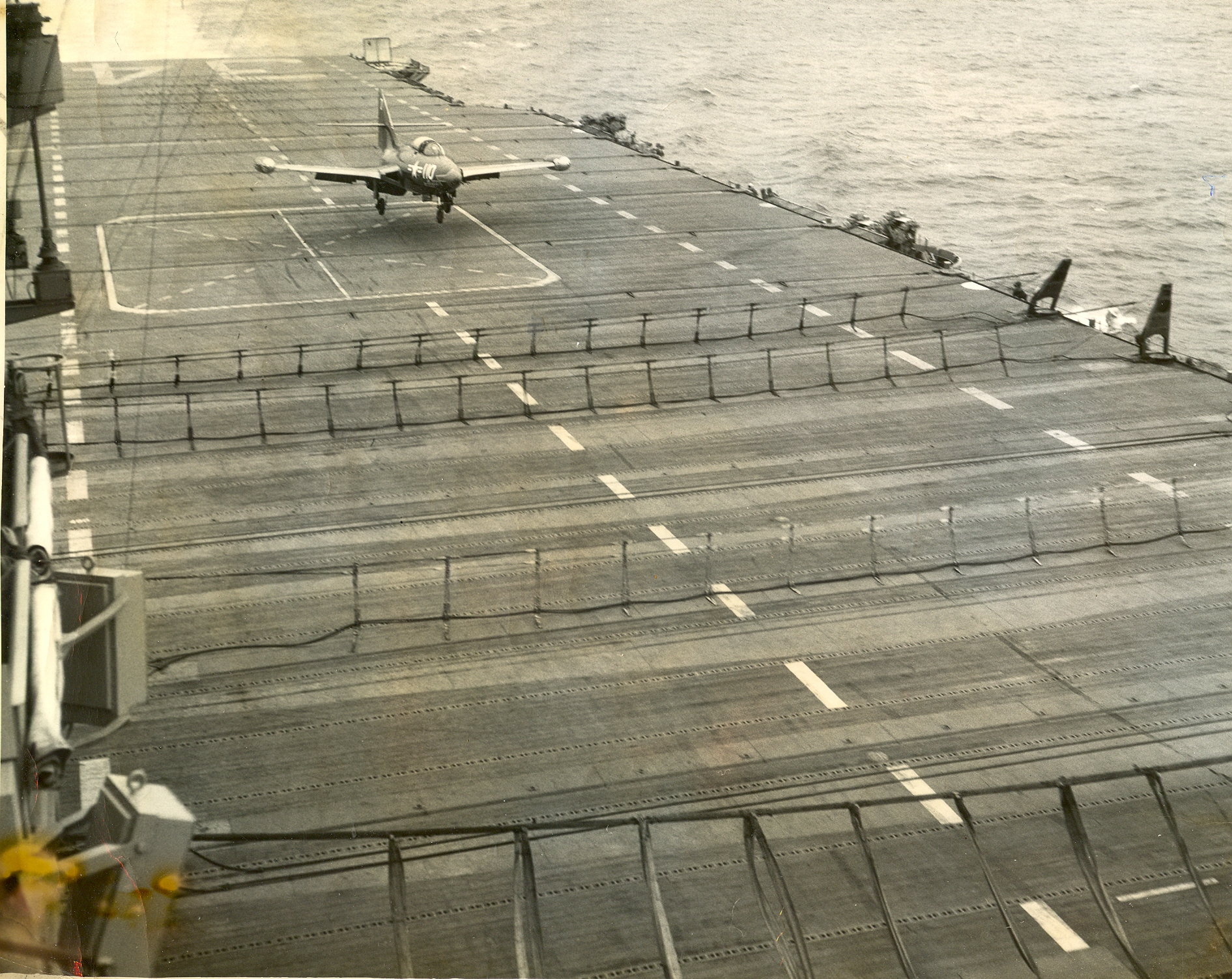 O'Connell, LTJG James, VF-781; F9F-5 BuNo. , USS Oriskany CV-34; 8-13-52. F9F going into barrier. Note #1 barrier being lowered in case Jim caught a wire.