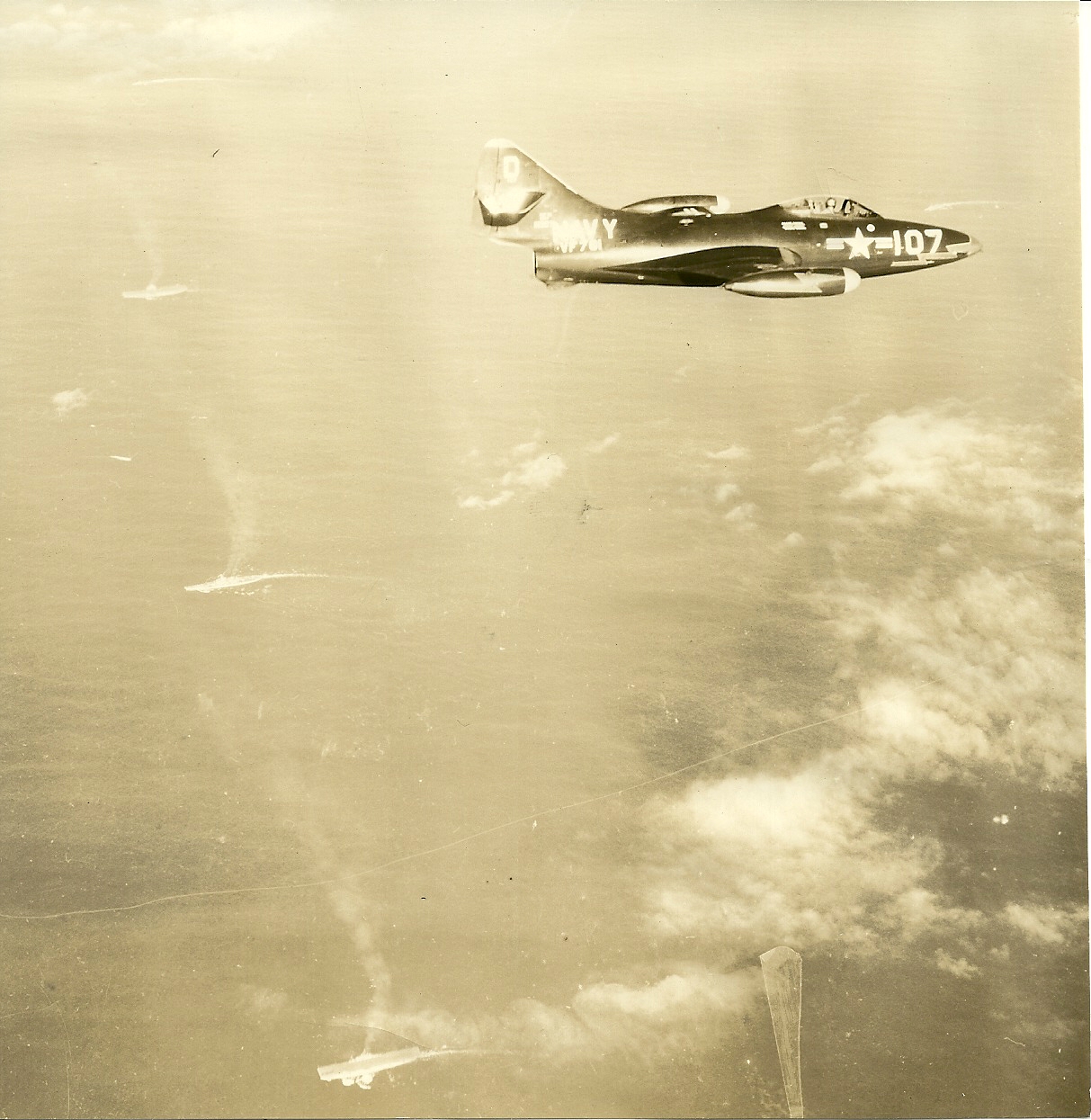 VF-781 F9F-2 over Task Force 77, Korea 1951. Note 2 CVs and BB as guide. Photo-VC-61 photo plane.