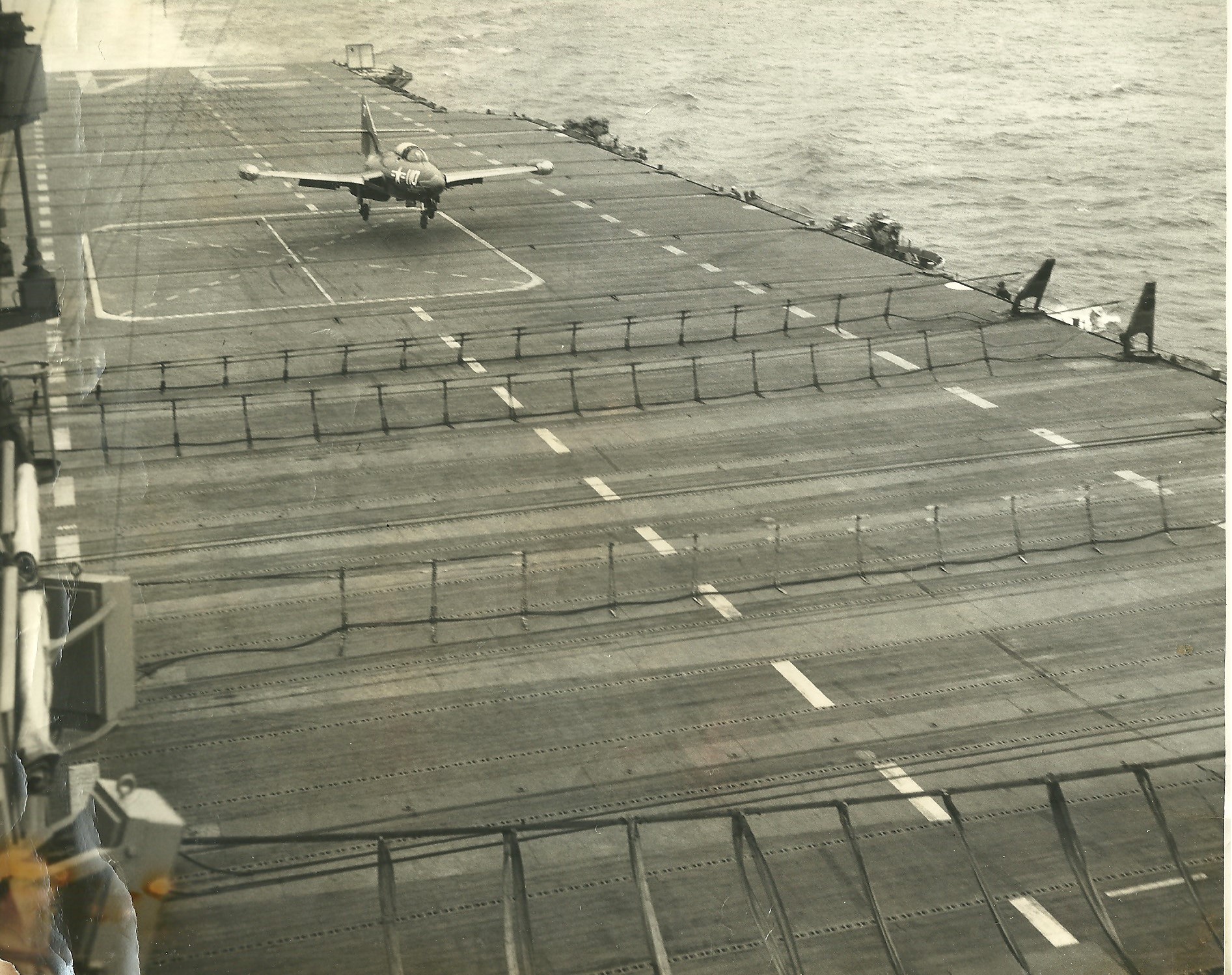 [aircraft] VF-781 F9F-5 going into barrier. CV-34 13 Aug 1952.